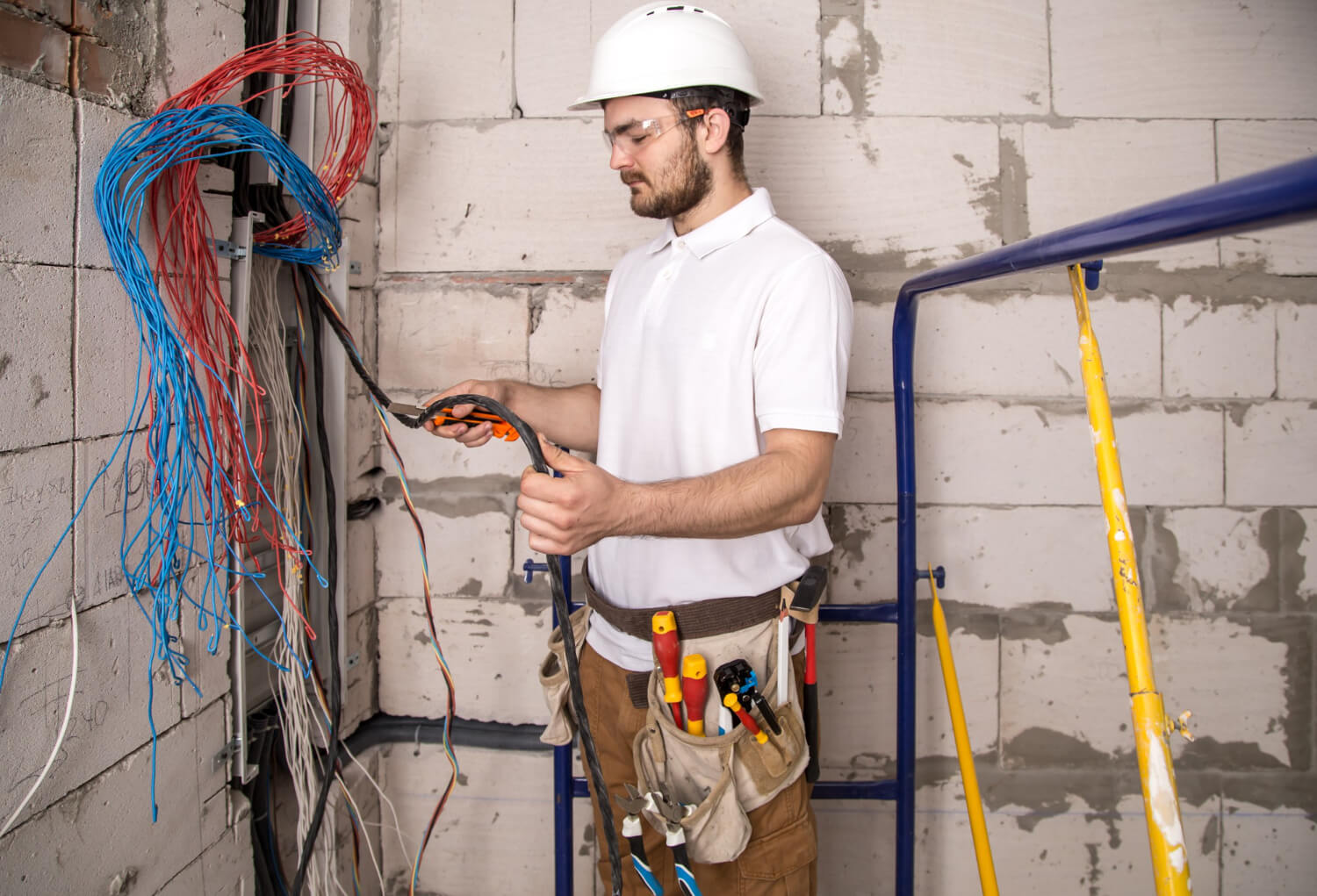 electrician-working-near-board-with-wires-installation-connection-electrics (1)